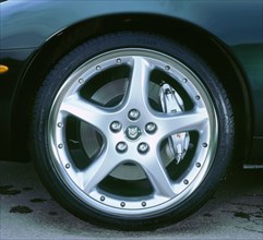 2002 Jaguar XKR convertible alloy wheel. Artist: Unknown.