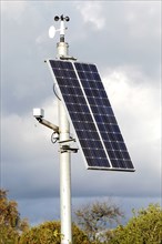 Solar Panel powering roadside equipment. Artist: Unknown.