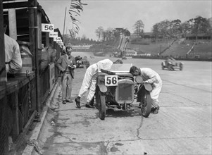 J Reeves and HHB Beacon's Austin Ulster at the JCC Double Twelve race, Brooklands, 8/9 May 1931. Artist: Bill Brunell.
