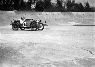 Austin Ulster of Victoria Worsley and R Latham-Boote, JCC Double Twelve race, Brooklands, 1931. Artist: Bill Brunell.