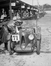 MG C type of Ron Horton and Bill Humphreys in the pits, JCC Double Twelve race, Brooklands, 1931. Artist: Bill Brunell.