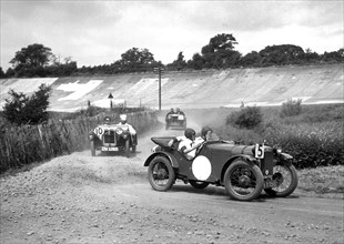 Two Austin Ulsters leading an MG, JCC Members Day, Brooklands, 4 July 1931. Artist: Bill Brunell.