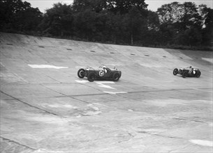 Two Riley 9 Brooklands racing on the banking at a JCC Members Day, Brooklands. Artist: Bill Brunell.