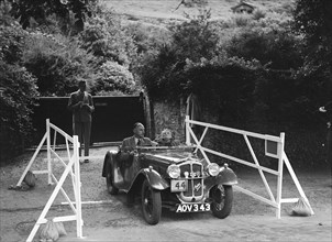 Austin 7 of JG Orford, winner of a premier award at the MCC Torquay Rally, July 1937. Artist: Bill Brunell.