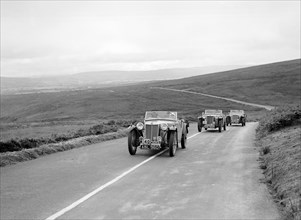 Three MG TAs competing at the MCC Torquay Rally, July 1937. Artist: Bill Brunell.