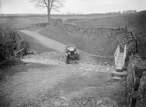 Kitty Brunell road testing a MG 18/80, Tan Hill, Yorkshire, April 1931. Artist: Bill Brunell.