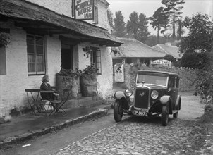 1931 Austin 16/6 on a road test, parked outside the Church House Inn, Stoke Gabriel, Devon. Artist: Bill Brunell.