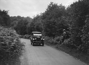 Morris Minor taking part in a First Aid Nursing Yeomanry trial or rally, 1931. Artist: Bill Brunell.