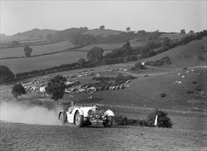 Aston Martin competing in the Singer CC Rushmere Hill Climb, Shropshire 1935. Artist: Bill Brunell.