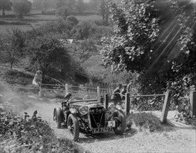 1933 Crossley Ten taking part in a West Hants Light Car Club Trial, Ibberton Hill, Dorset, 1930s. Artist: Bill Brunell.