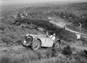 1935 MG PB of the Cream Cracker team taking part in the NWLMC Lawrence Cup Trial, 1937. Artist: Bill Brunell.