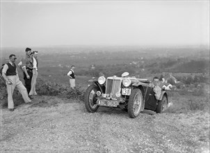 1936 MG TA of the Three Musketeers team taking part in the NWLMC Lawrence Cup Trial, 1937. Artist: Bill Brunell.