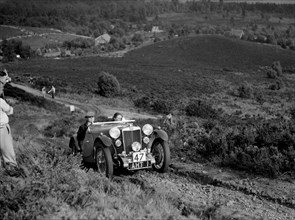 1933 MG J2 team taking part in the NWLMC Lawrence Cup Trial, 1937. Artist: Bill Brunell.