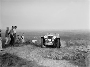 1936 MG PB 2-seater sports taking part in the NWLMC Lawrence Cup Trial, 1937. Artist: Bill Brunell.