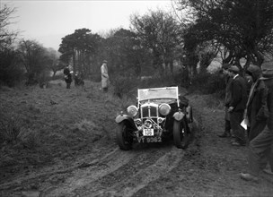 Wolseley Hornet of AK Hunt at the Sunbac Colmore Trial, near Winchcombe, Gloucestershire, 1934. Artist: Bill Brunell.