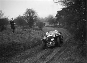 MG Magna of KC Delingpole at the Sunbac Colmore Trial, near Winchcombe, Gloucestershire, 1934. Artist: Bill Brunell.