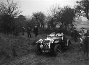 Wolseley Hornet of HK Crawford at the Sunbac Colmore Trial, near Winchcombe, Gloucestershire, 1934. Artist: Bill Brunell.