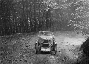 MG J2 competing in the B&HMC Brighton-Beer Trial, Fingle Bridge Hill, Devon, 1934. Artist: Bill Brunell.