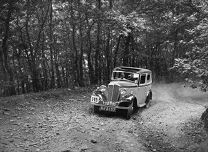 Standard competing in the B&HMC Brighton-Beer Trial, Fingle Bridge Hill, Devon, 1934. Artist: Bill Brunell.