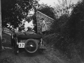 MG F Magna competing in the JCC Lynton Trial, 1932. Artist: Bill Brunell.