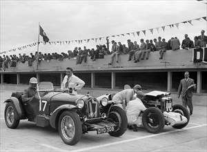 Alfa Romeo and supercharged MG Midget on the start line at Brooklands, 1938 or 1939. Artist: Bill Brunell.