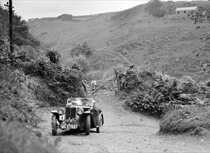 MG Magnette taking part in a motoring trial in Devon, late 1930s. Artist: Bill Brunell.