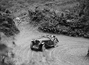 1935 MG PB taking part in a motoring trial in Devon, late 1930s. Artist: Bill Brunell.