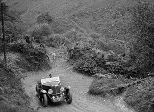 1934 Triumph taking part in a motoring trial in Devon, late 1930s. Artist: Bill Brunell.