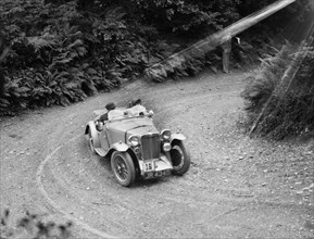 1936 MG PB taking part in a motoring trial in Devon, late 1930s. Artist: Bill Brunell.