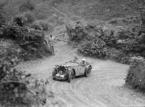 1934 MG PA of the Cream Cracker team taking part in a motoring trial in Devon, late 1930s. Artist: Bill Brunell.