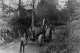 1869 Tasker traction engine with red flag man at the front