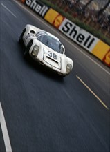 Porsche 910-6 driven by Stommelen - Neerpasch, 1967 Le Mans Artist: Unknown.