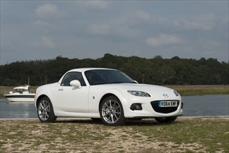 2014 Mazda MX5 Roadster Coupe Artist: Unknown.