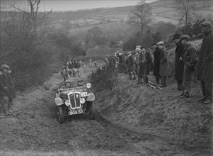 Austin 7 Grasshopper of WH Scriven competing in the MG Car Club Midland Centre Trial, 1938. Artist: Bill Brunell.