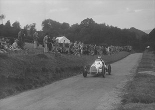 Austin 7 of LP Driscoll competing in the MAC Shelsley Walsh Speed Hill Climb, Worcestershire, 1935. Artist: Bill Brunell.