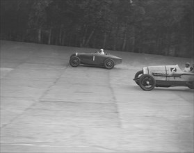 Bugatti of Kaye Don and Delage of J Taylor, Surbiton Motor Club race meeting, Brooklands, 1928. Artist: Bill Brunell.