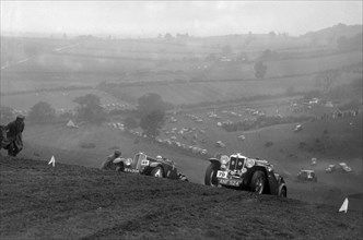 Triumph Southern Cross and MG Magnette at the MG Car Club Rushmere Hillclimb, Shropshire, 1935. Artist: Bill Brunell.