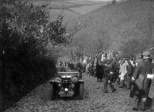 MG Magnette of JW Fox competing in the MCC Lands End Trial, Beggars Roost, Devon, 1936. Artist: Bill Brunell.