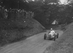 Austin competing in the Shelsley Walsh Amateur Hillclimb, Worcestershire, 1929. Artist: Bill Brunell.