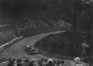 Unidentified open 4-seater car competing in the Shelsley Walsh Hillclimb, Worcestershire, 1935. Artist: Bill Brunell.