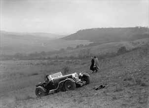 Aston Martin competing in the London Motor Club Coventry Cup Trial, Knatts Hill, Kent, 1938. Artist: Bill Brunell.