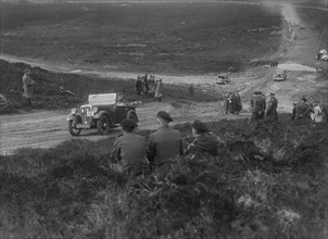 Morris Minor competing in a motoring trial, Bagshot Heath, Surrey, 1930s. Artist: Bill Brunell.