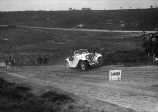 1934 Singer Le Mans competing in a motoring trial, Bagshot Heath, Surrey, 1930s. Artist: Bill Brunell.