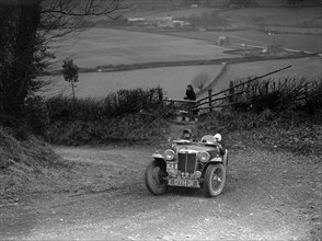 MG TA of JF Kingham competing in the MG Car Club Midland Centre Trial, 1938. Artist: Bill Brunell.
