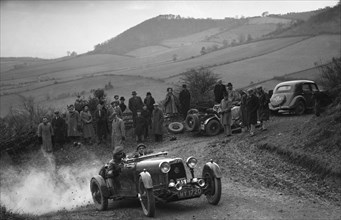 Aston Martin 2-seater of JD Keightley competing in the MG Car Club Midland Centre Trial, 1938. Artist: Bill Brunell.