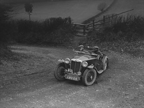 MG TA of HV Slade competing in the MG Car Club Midland Centre Trial, 1938. Artist: Bill Brunell.