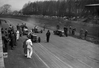 MG Q type, Frazer-Nash Shelsley and Bugatti Type 51 on the starting grid at Donington Park, 1930s. Artist: Bill Brunell.