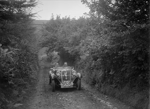 Singer open 2-seater competing in the Mid Surrey AC Barnstaple Trial, 1934. Artist: Bill Brunell.