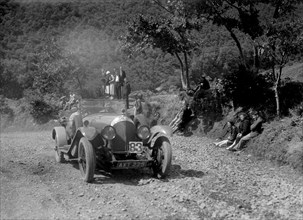 Bentley open 4-seater of FE Elgood competing in the Mid Surrey AC Barnstaple Trial, 1934. Artist: Bill Brunell.