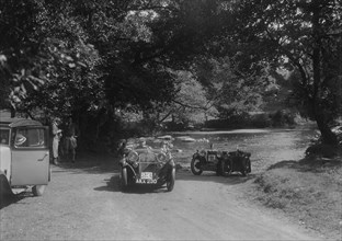 Singer Le Mans and MG D type at the Mid Surrey AC Barnstaple Trial, Tarr Steps, Exmoor, 1934. Artist: Bill Brunell.